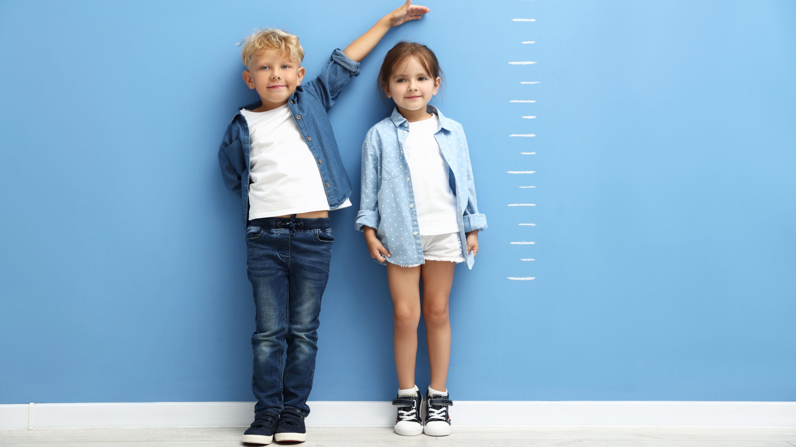 cute-little-girl-and-boy-measuring-their-heights-n-2026-05-07-20-17-50-utc_Crop Image (1)