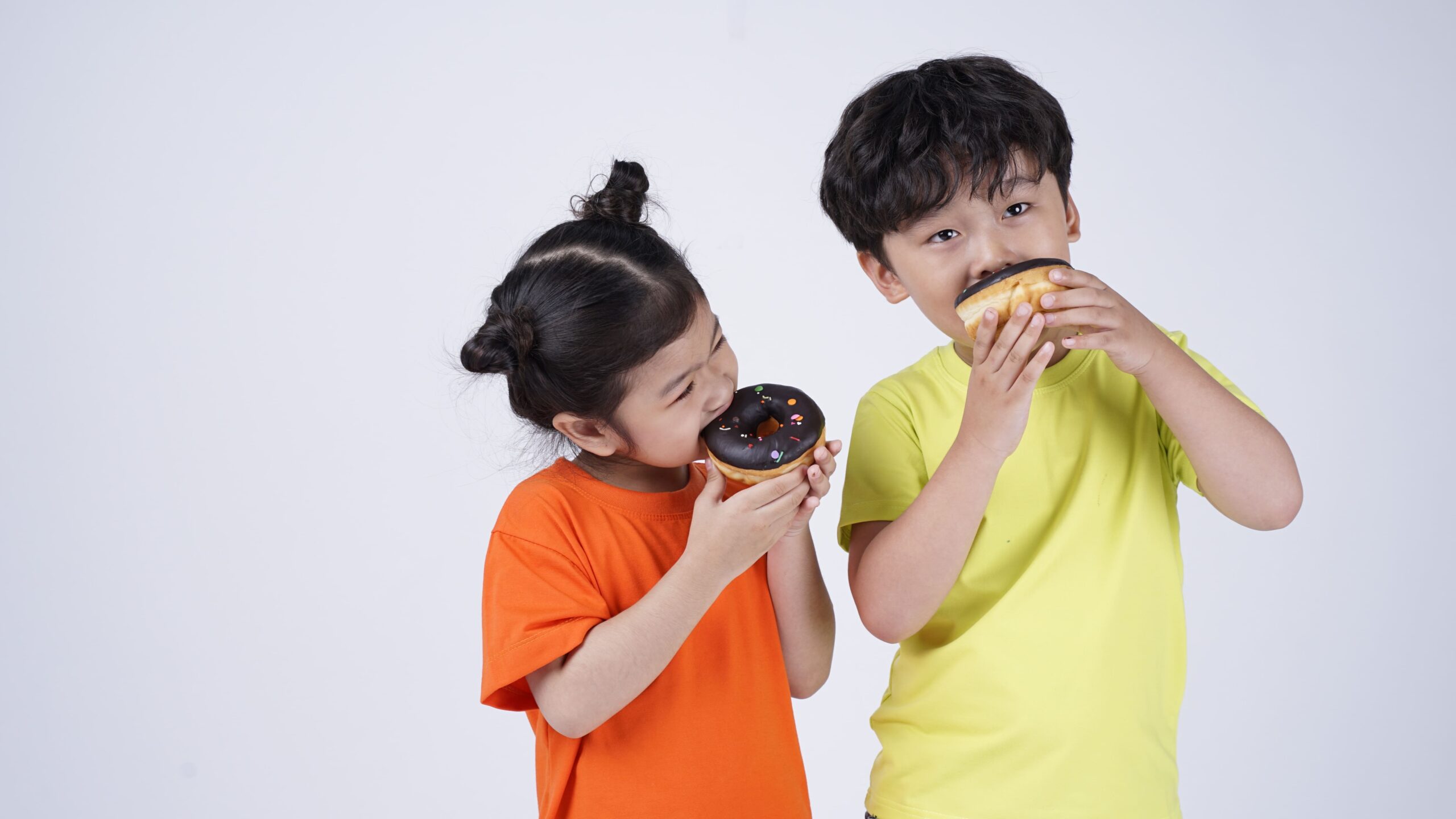 children-enjoying-donuts-in-a-bright-studio-settin-2026-01-11-09-13-17-utc_Crop Image (1)