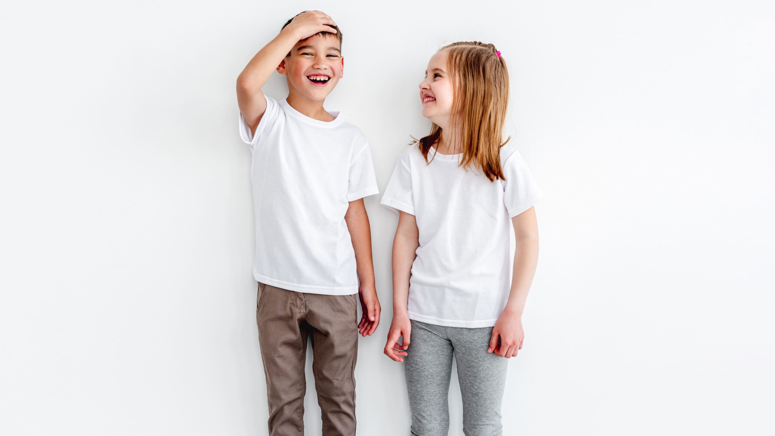smiling-children-standing-in-front-of-a-white-wall-2026-01-09-08-11-12-utc_Crop Image (1)