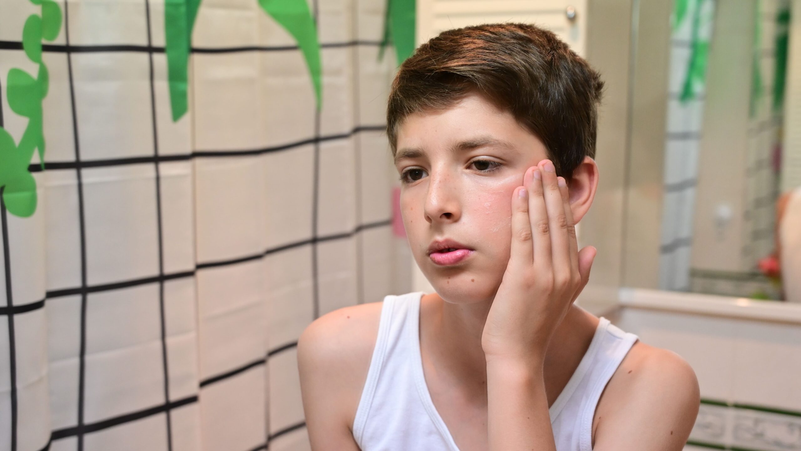 teenage-boy-examining-red-irritated-skin-on-his-ch-2026-06-22-19-09-26-utc_Crop Image (1) (1)