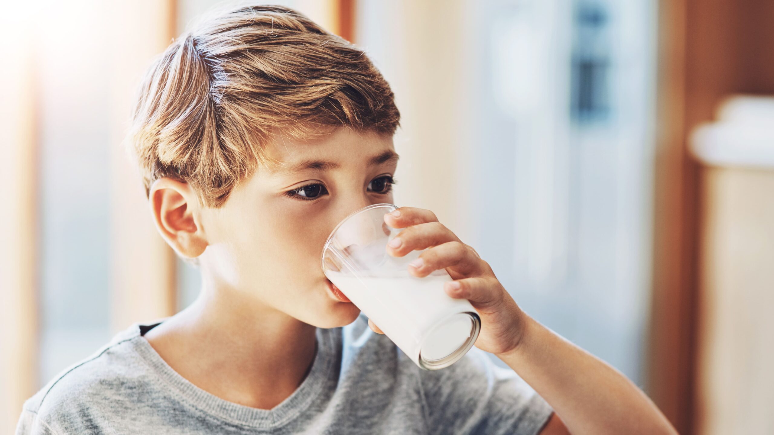 boy-drinks-a-glass-of-milk-indoors-2026-09-22-05-23-47-utc_Crop Image (1)